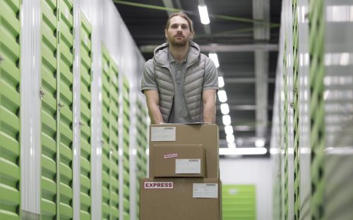 full-shot-man-working-logistic-center